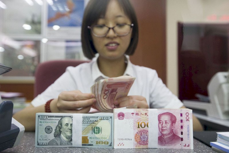 中國守人民幣7關卡？ 外資銀看法兩極